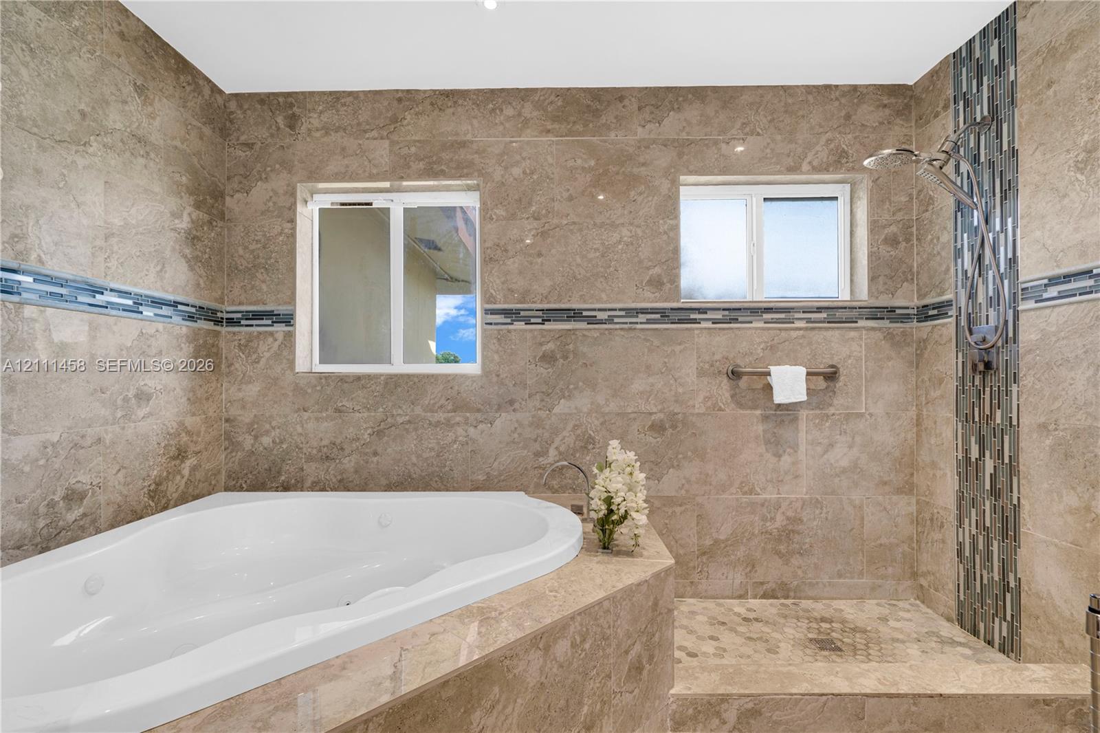 Soaking tub and walk-in shower and dual windows