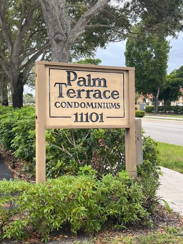 Freestanding monument sign featuring a wood-frame construction with inset professional lettering Freestanding monument sign featuring a wood-frame construction with inset professional lettering