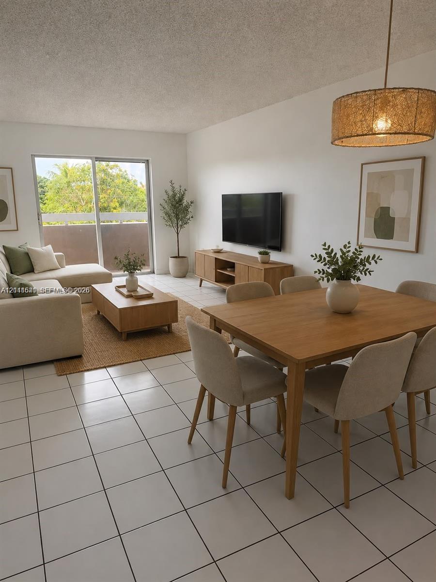 Neutral tile flooring, sliding glass door, and woven drum pendant light fixture Neutral tile flooring, sliding glass door, and woven drum pendant light fixture