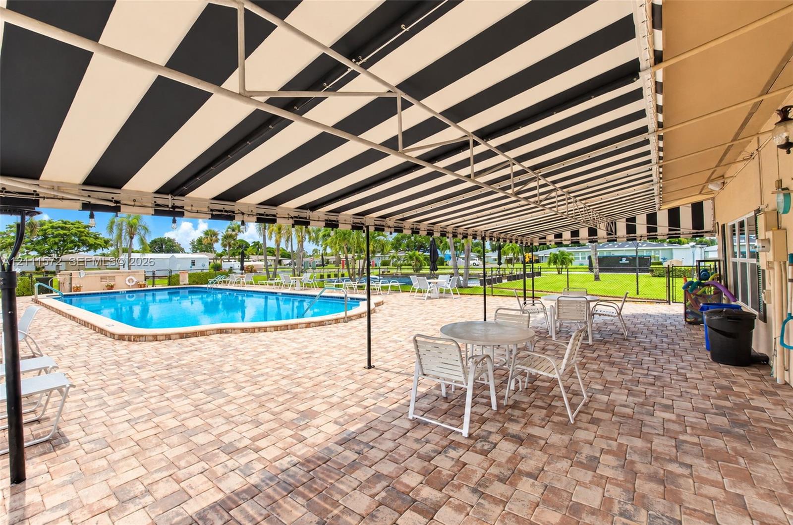 Covered patio by the heated pool