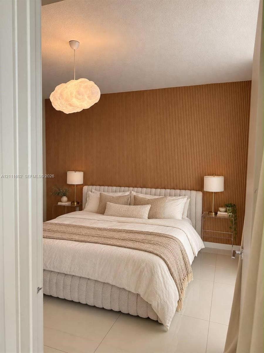 Vertical wood-slat accent wall, tile flooring, and sculptural cloud-shaped pendant lighting