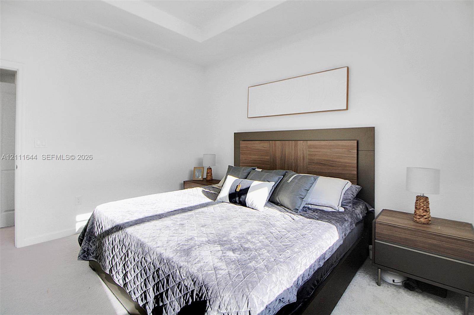 Tray ceiling detailing and neutral wall palette