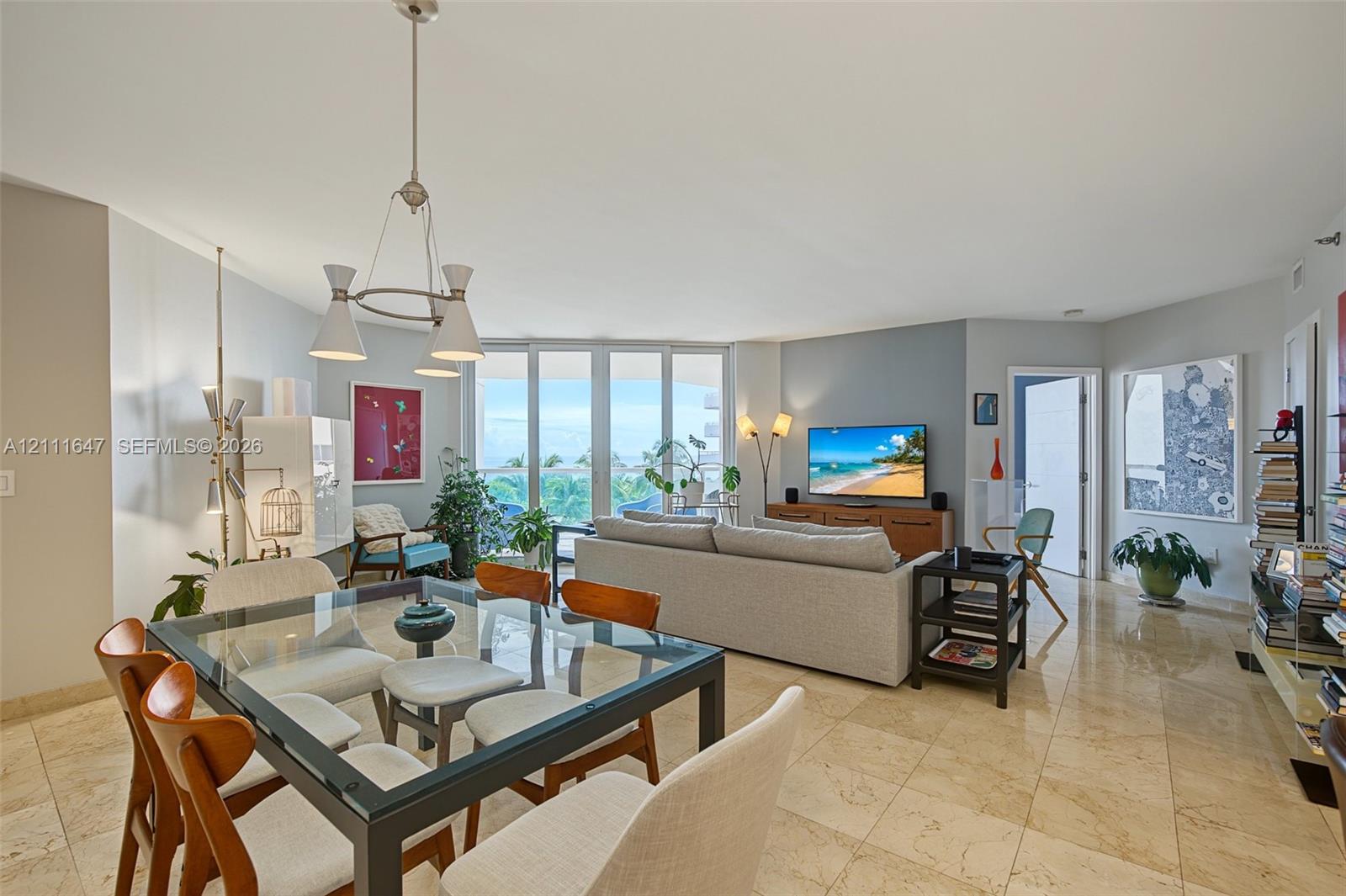 Open-concept living area featuring floor-to-ceiling windows