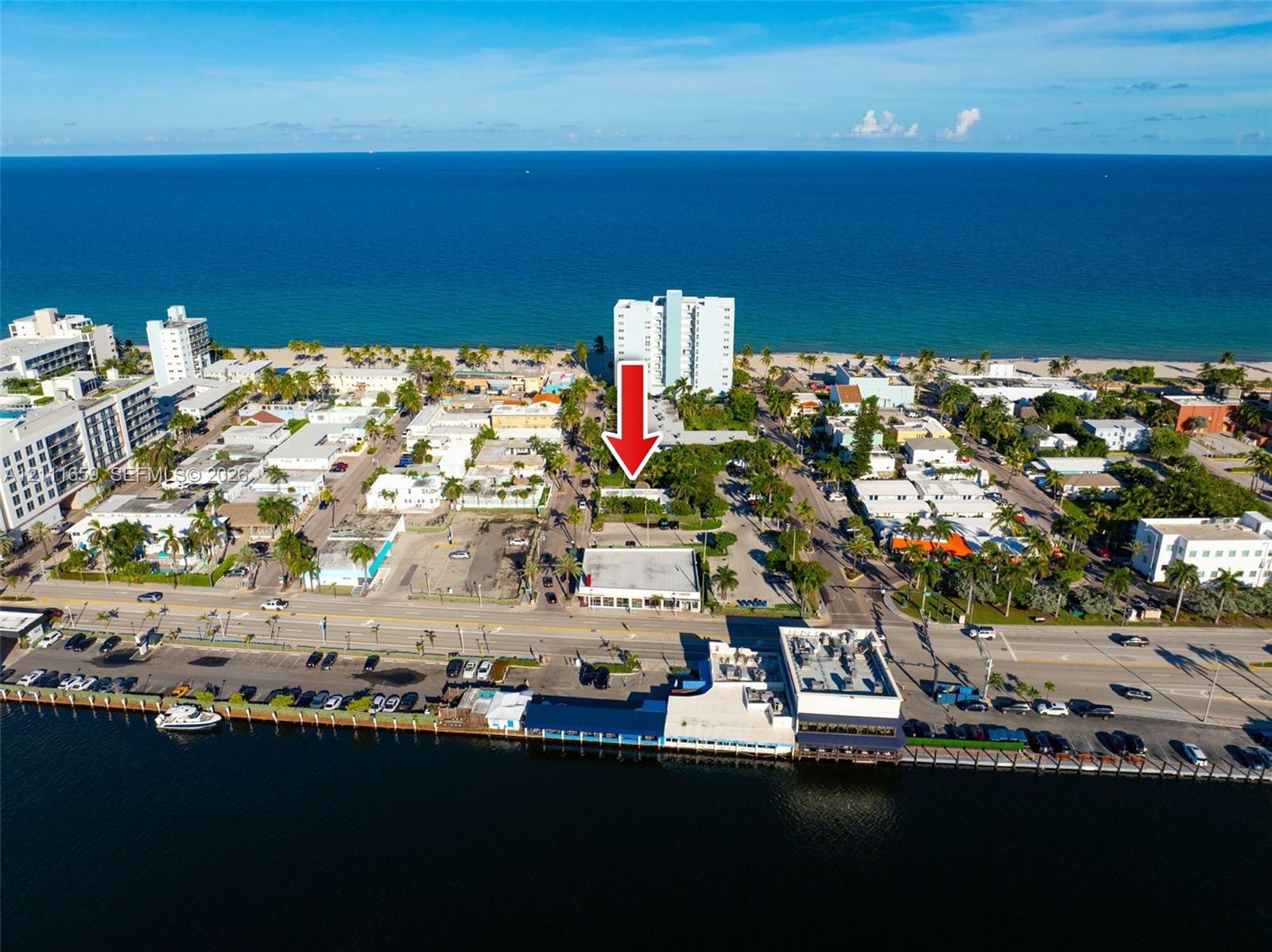 Aerial coastal perspective featuring proximity to the shoreline and waterfront access
