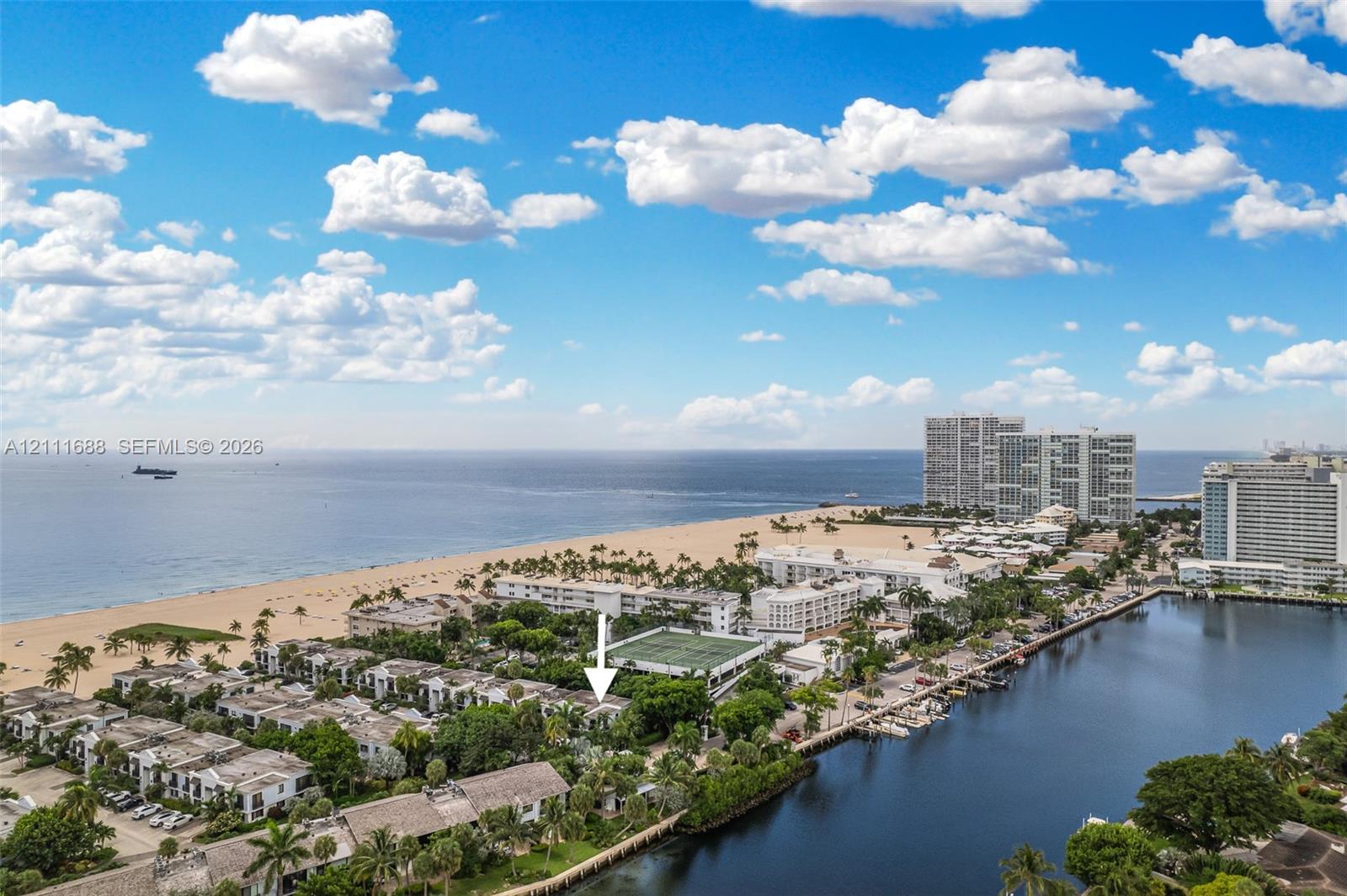 Aerial perspective featuring coastal proximity, oceanfront access, adjacent waterway, and mature tropical landscaping Aerial perspective featuring coastal proximity, oceanfront access, adjacent waterway, and mature tropical landscaping
