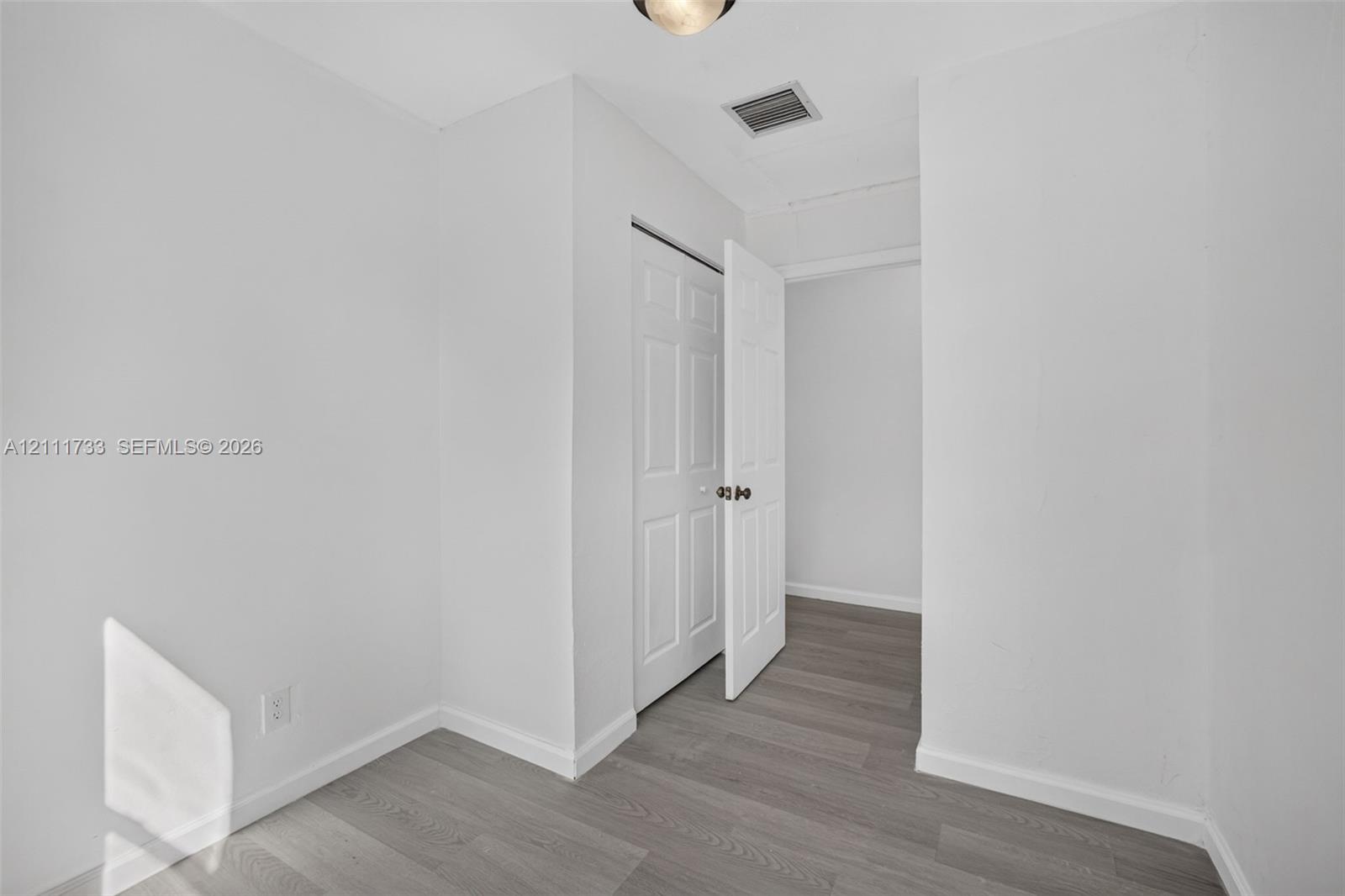Rear bedroom entranceway with Lock-off door to front of house