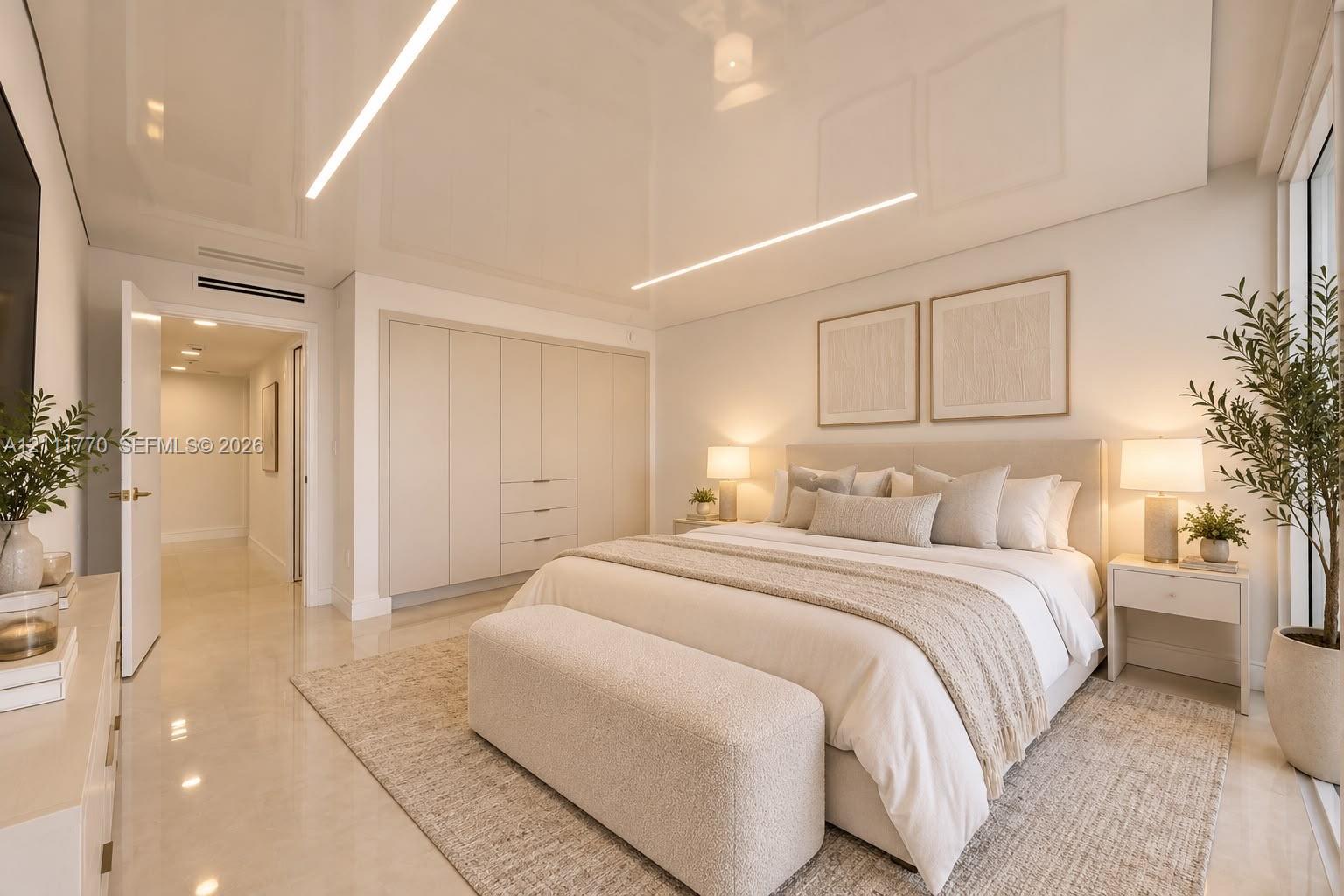 High-gloss ceiling with integrated linear LED lighting, polished large-format tile flooring, and floor-to-ceiling built-in cabinetry
