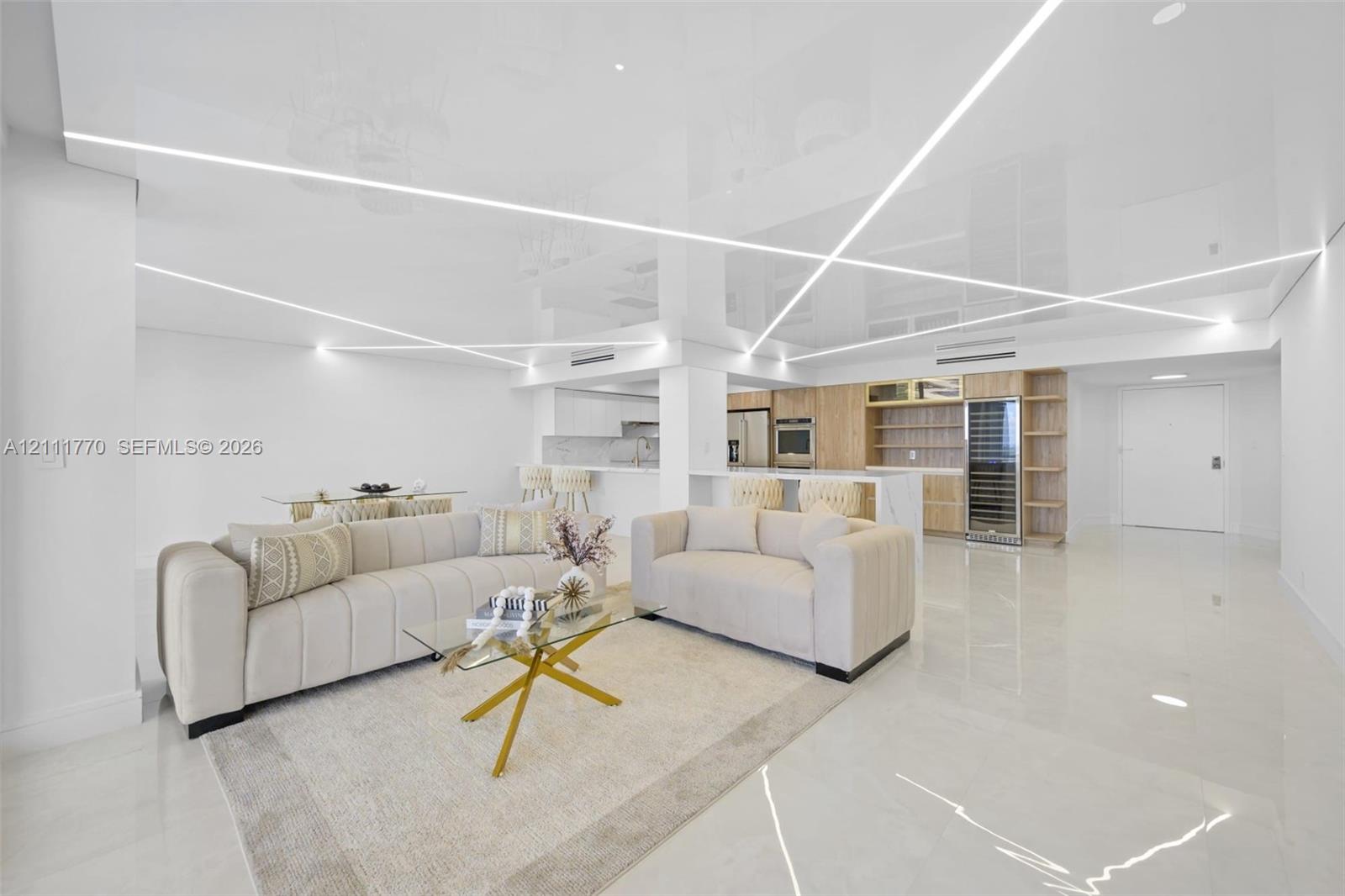 High-gloss, reflective ceiling featuring integrated geometric linear lighting