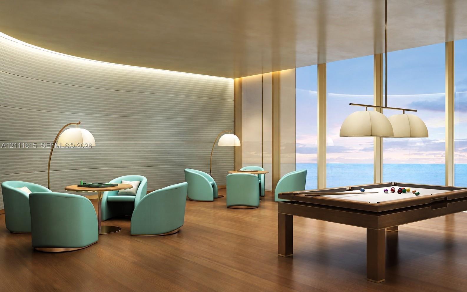 Curved, textured wall detailing, floor-to-ceiling windows, wood-finish flooring, and multi-light pendant illumination