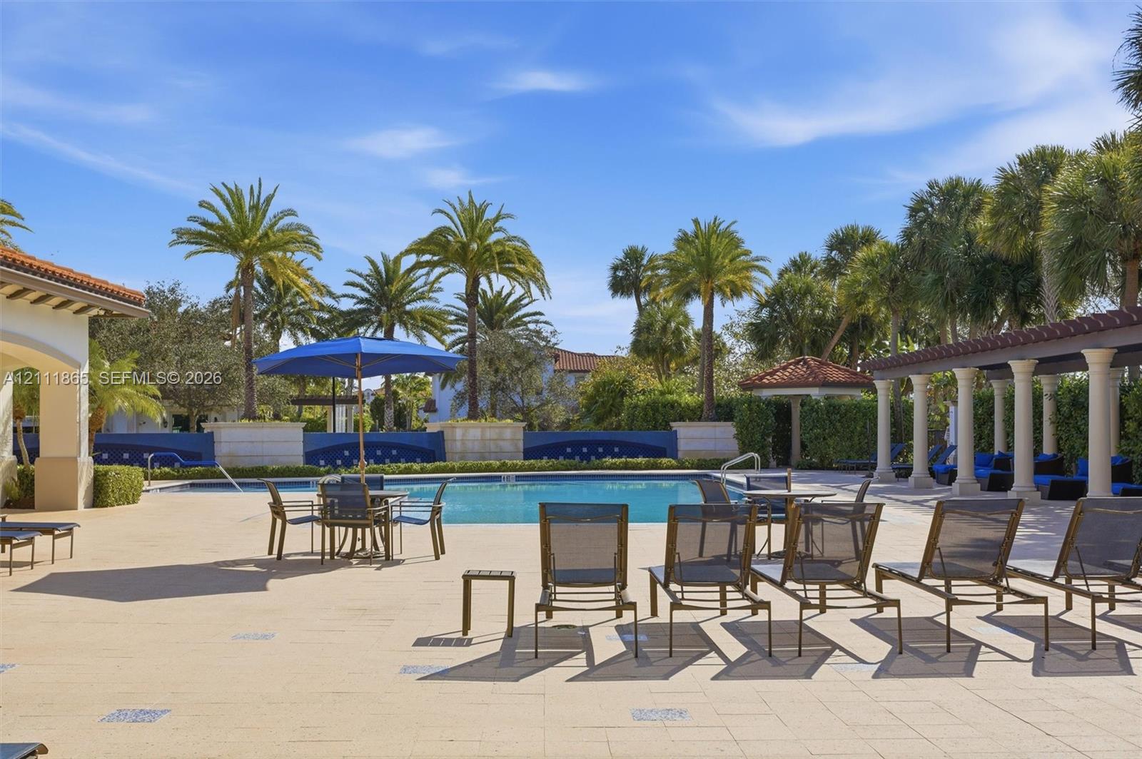 Pool area with deckchairs