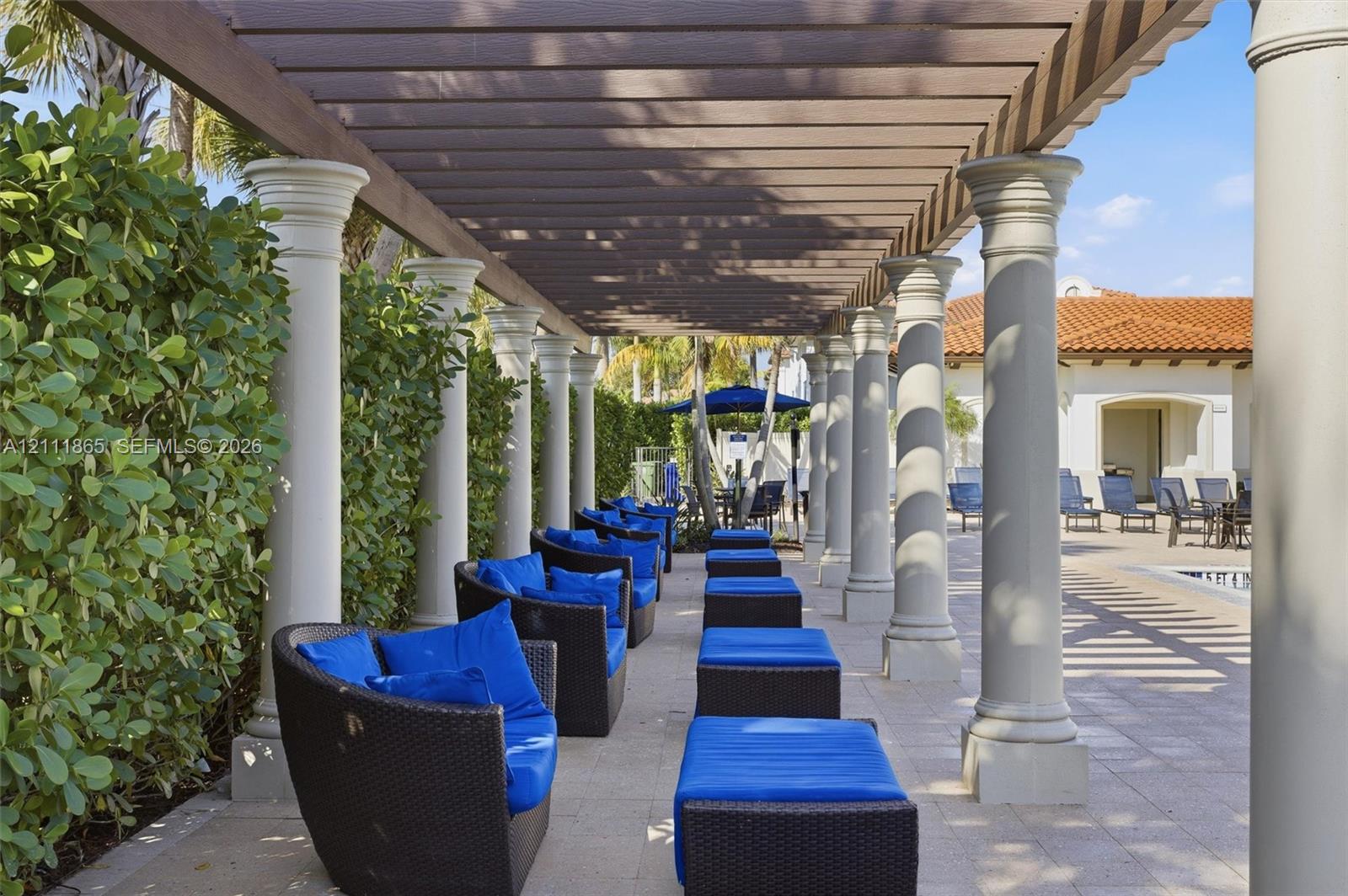 Covered pergola for shaded comfort at poolside