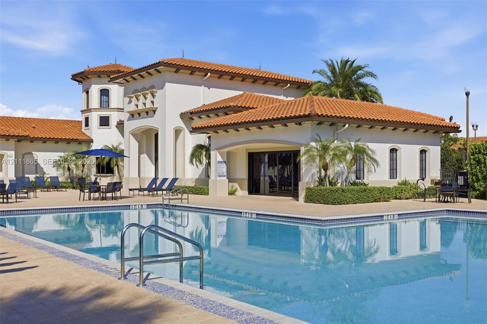 Heated community pool with office/clubhouse in background