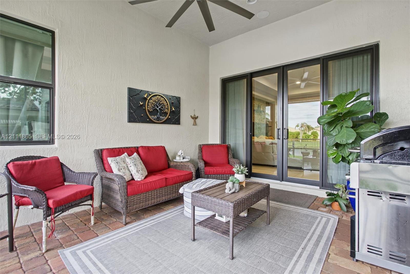 Screened lanai with lighted ceiling fan.