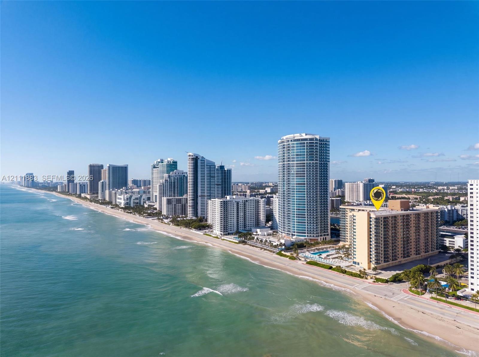 High-rise residential building situated on the Atlantic coastline featuring direct beach access and proximity to urban infrastructure High-rise residential building situated on the Atlantic coastline featuring direct beach access and proximity to urban infrastructure