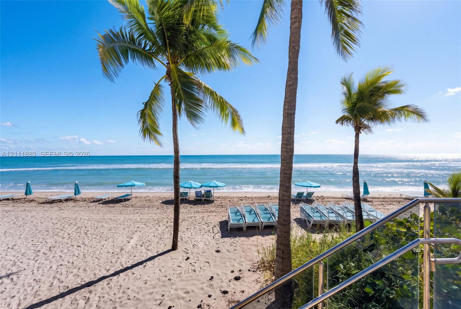 Direct beach access with stainless steel railing and glass panel balustrade