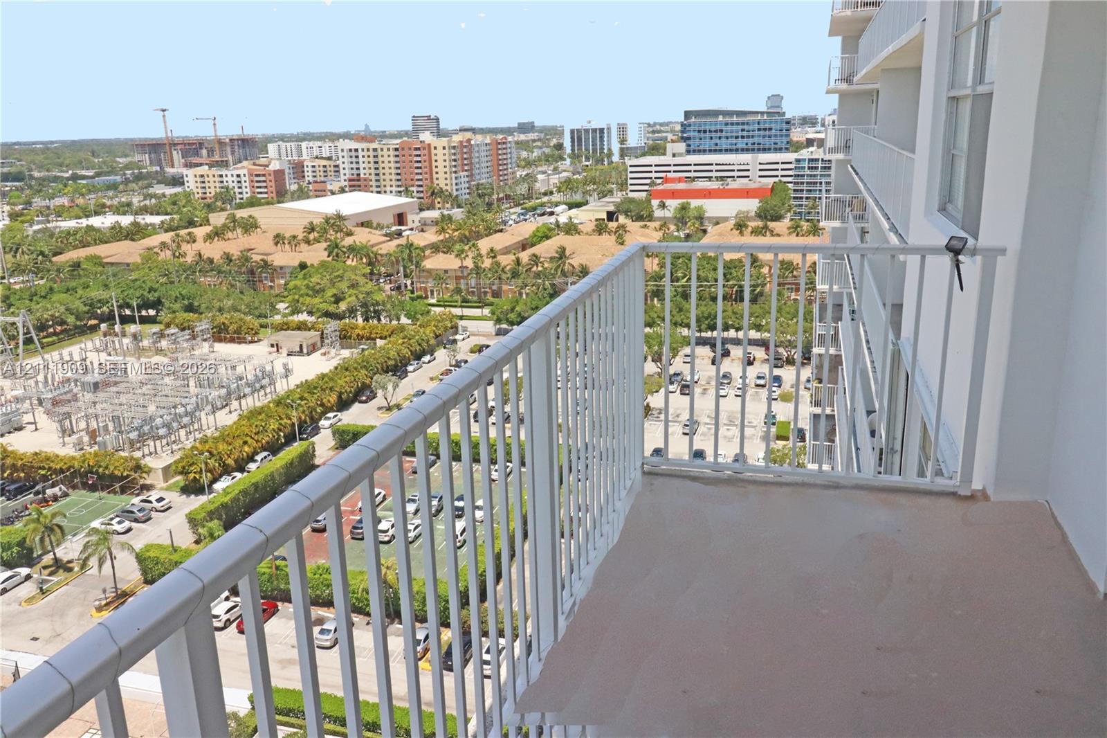 Private balcony featuring metal railings and concrete flooring