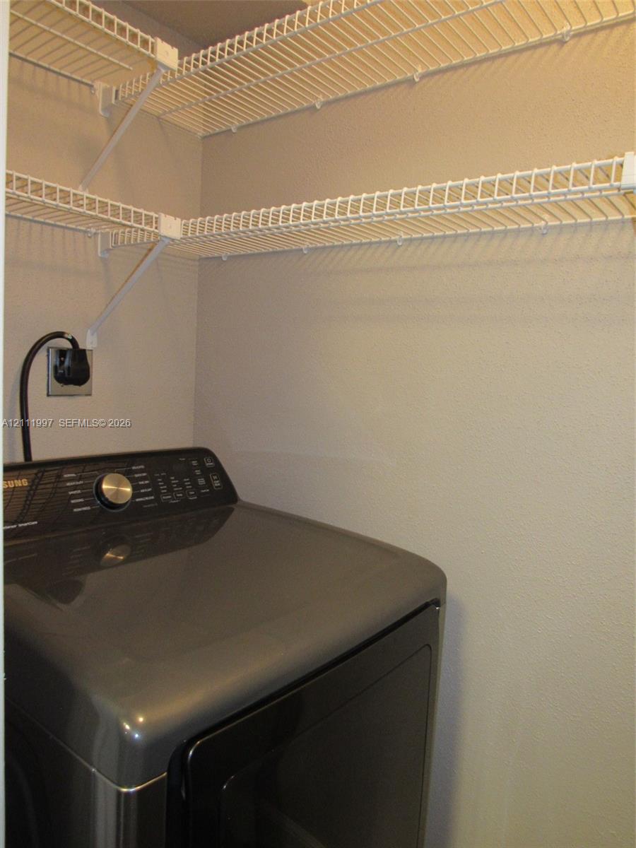 Built-in white wire shelving providing tiered storage