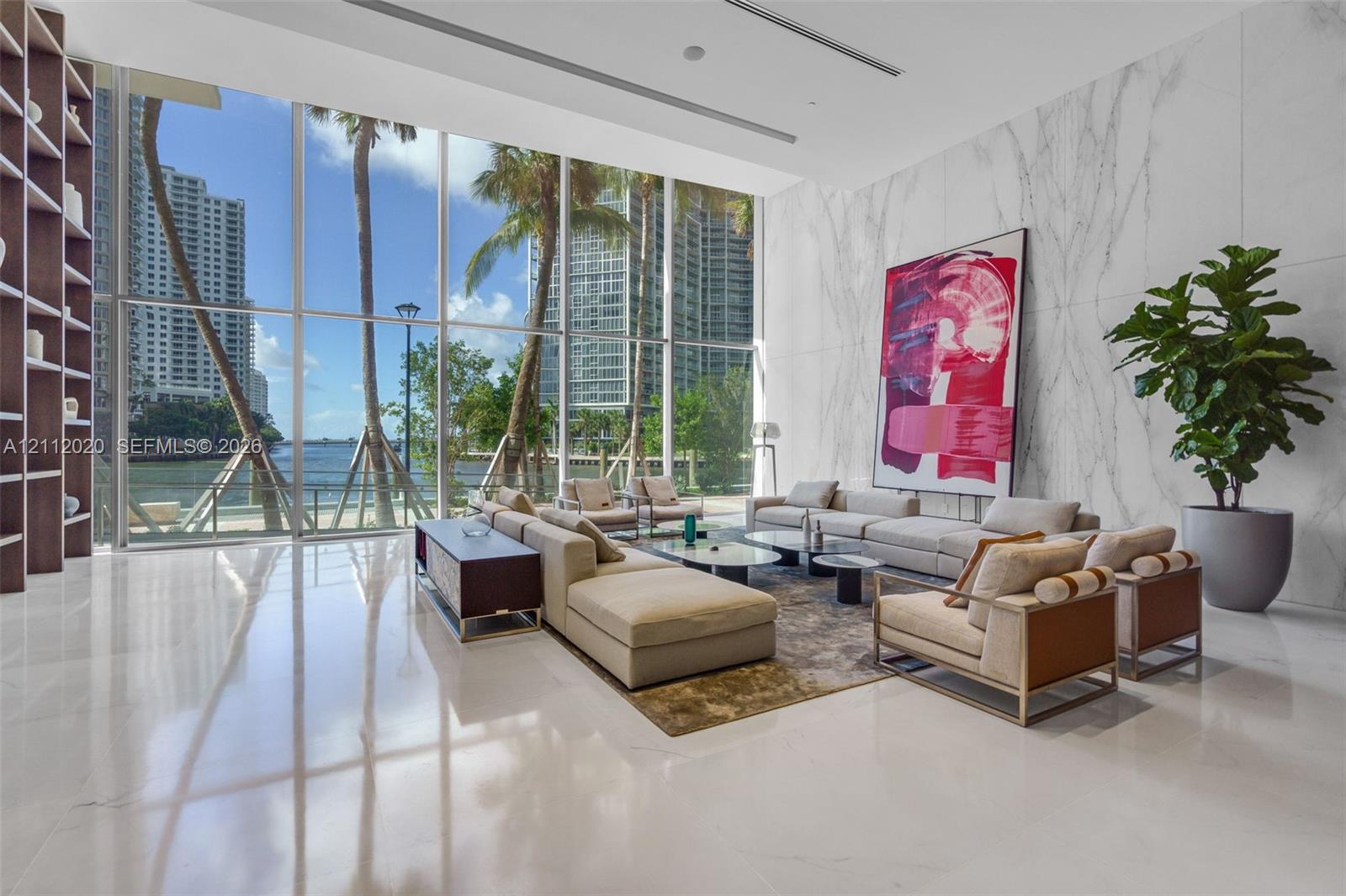 Floor-to-ceiling windows, full-height stone wall cladding, polished stone flooring, and custom built-in shelving