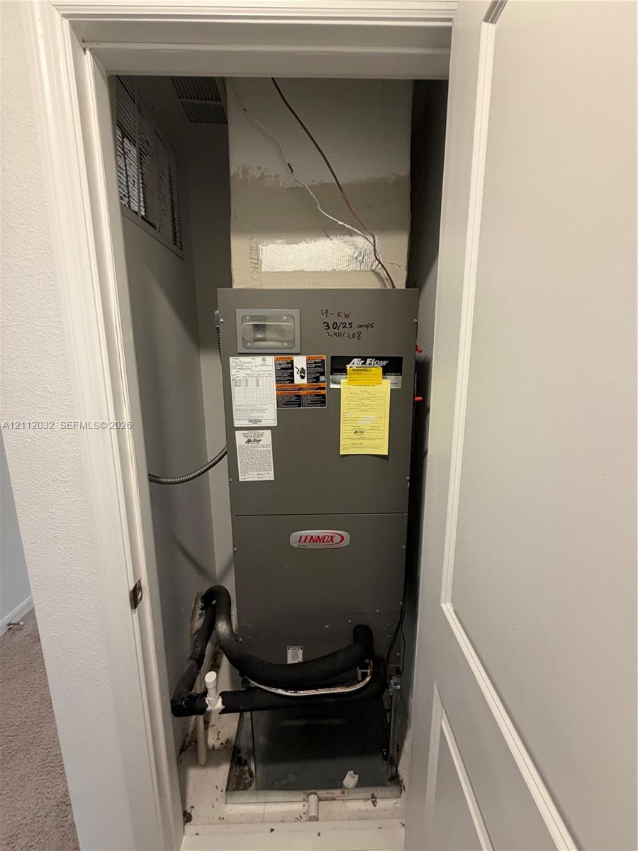 Lennox heating and cooling unit housed within a dedicated mechanical closet