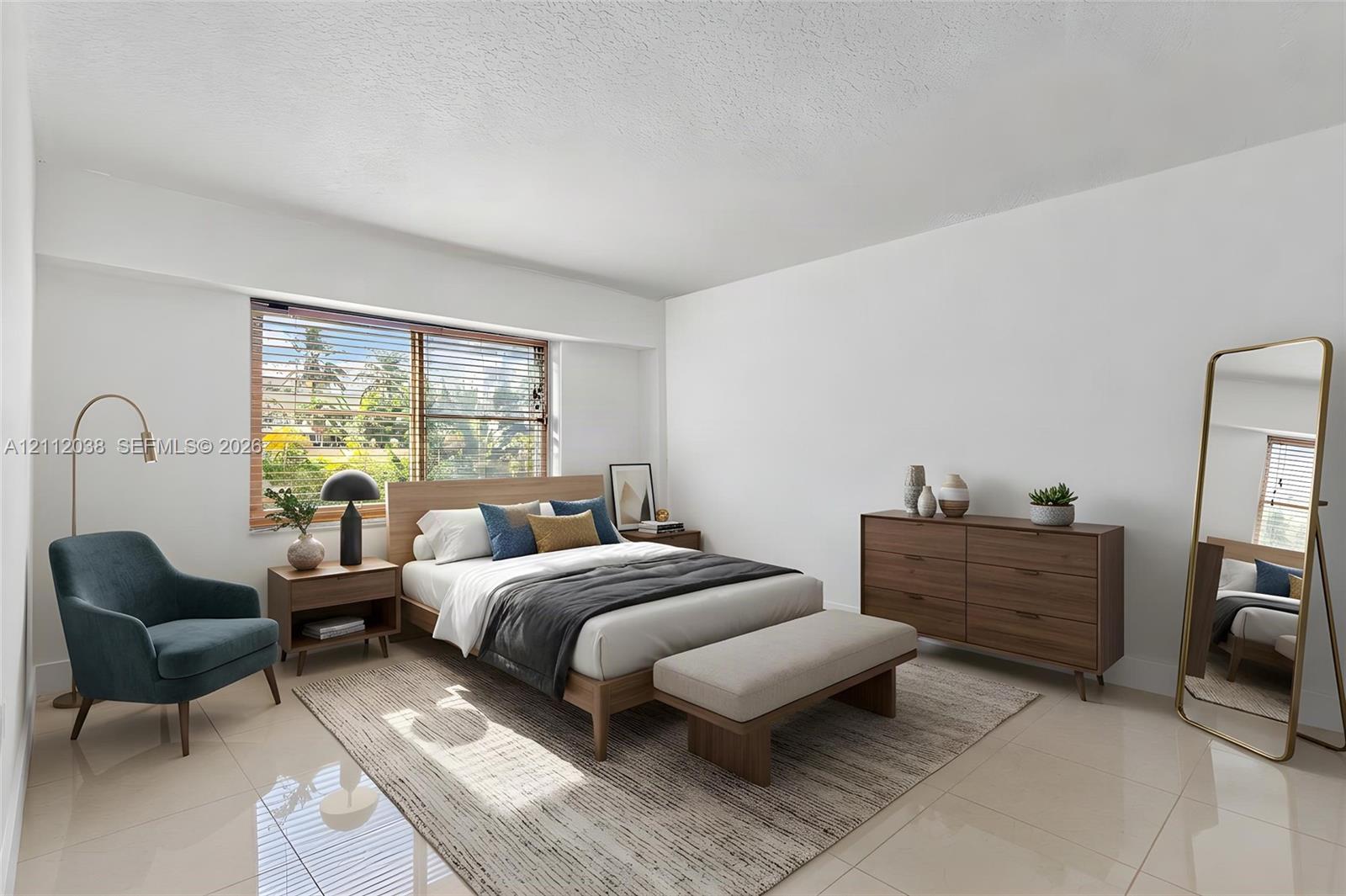 Large-format tile flooring and a wide, multi-pane window featuring horizontal blinds