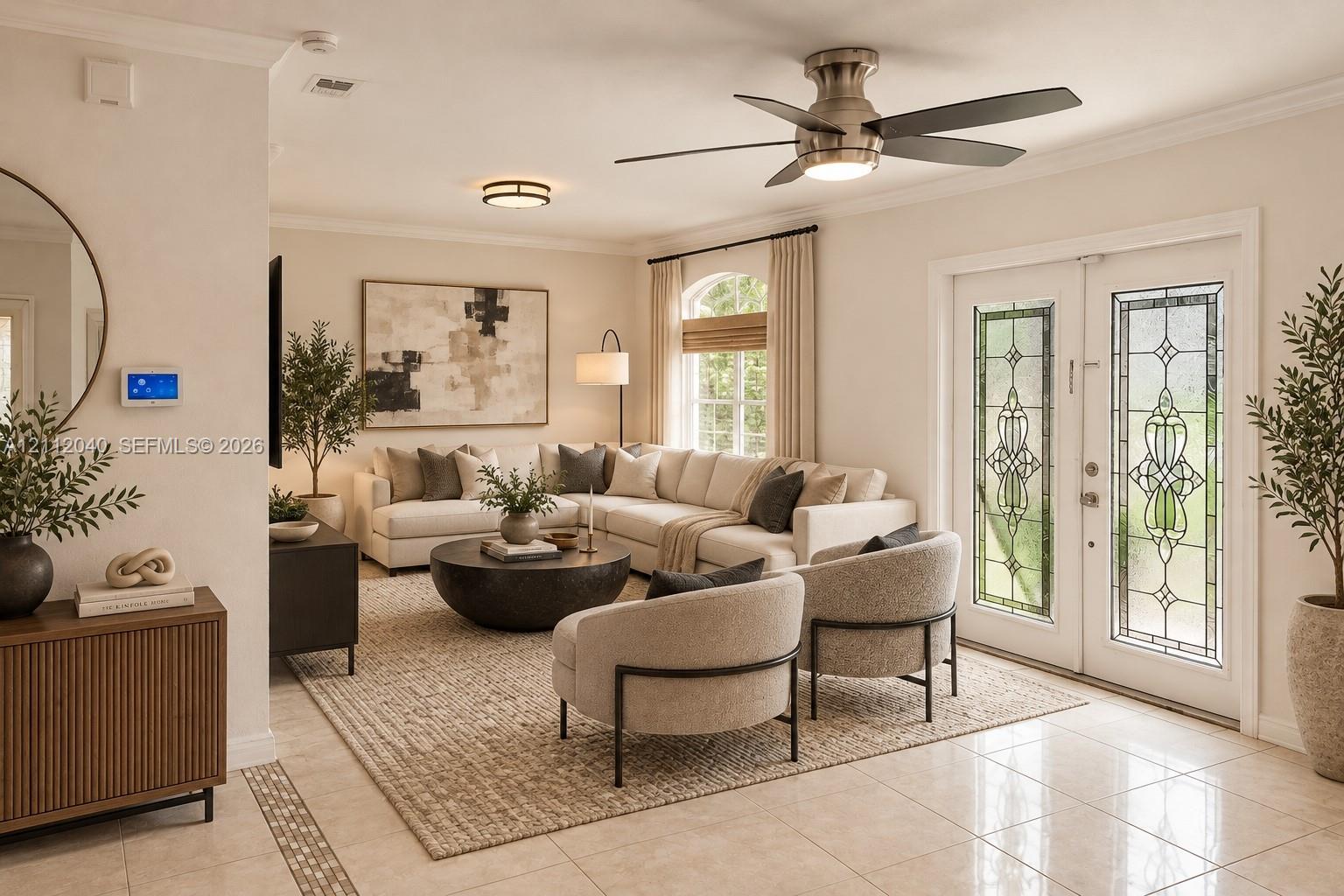 Double French doors featuring stained glass inserts, crown molding, a brushed nickel ceiling fan with integrated lighting, a flush-mount circular fixture, and polished tile flooring