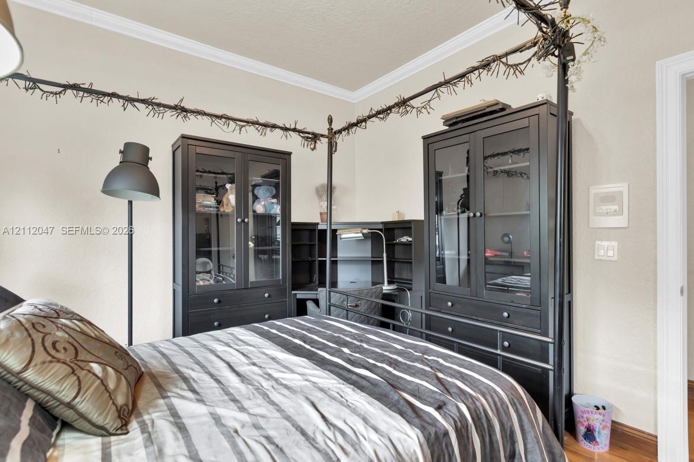 Room featuring crown molding and neutral wall paint