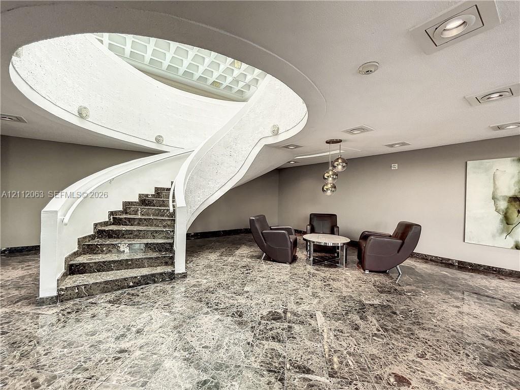 Extended lobby to stairs to the pool and clubhouse