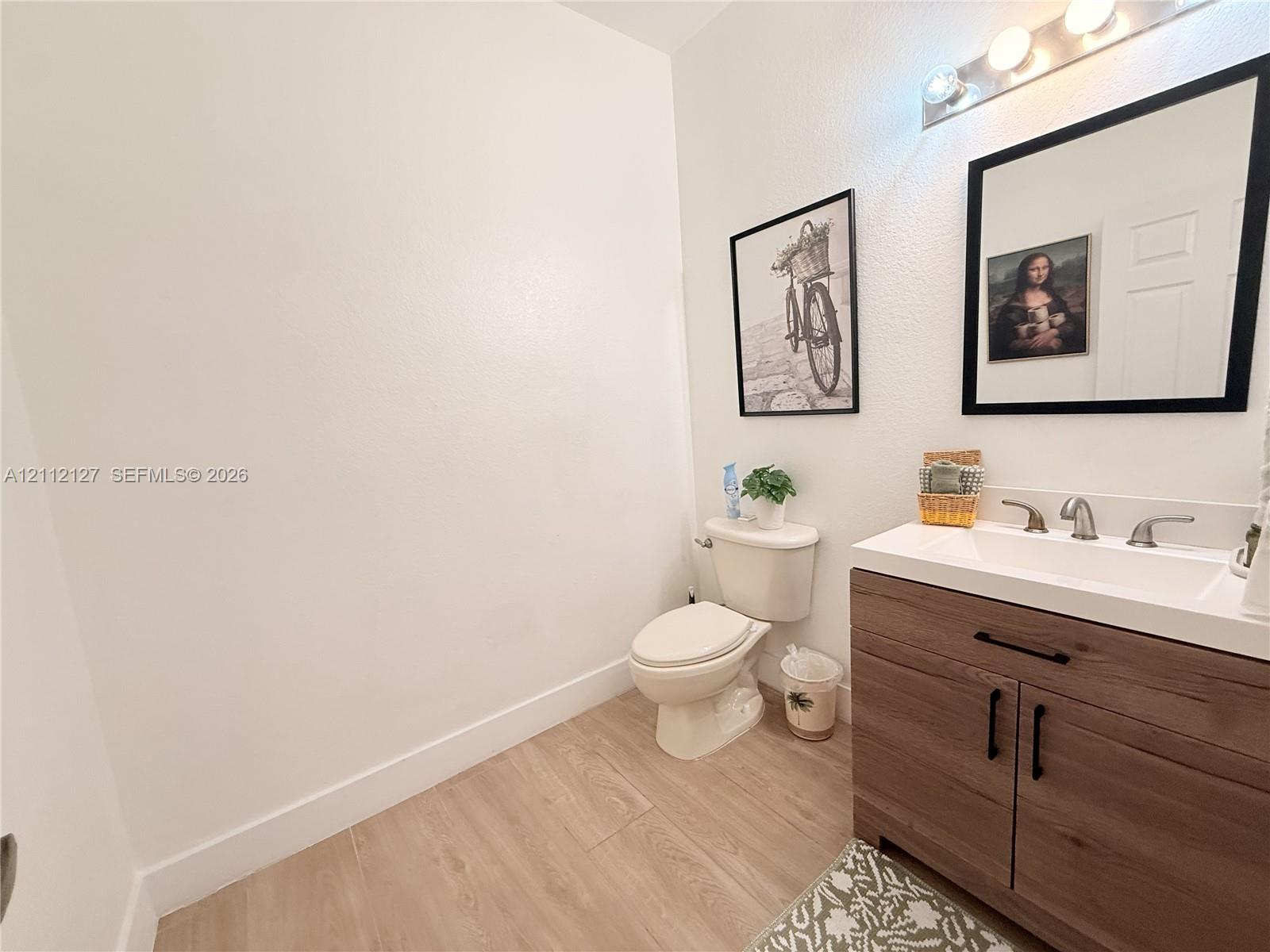 Laundry closet featuring bi-fold doors, white appliance hookups, and integrated wire shelving