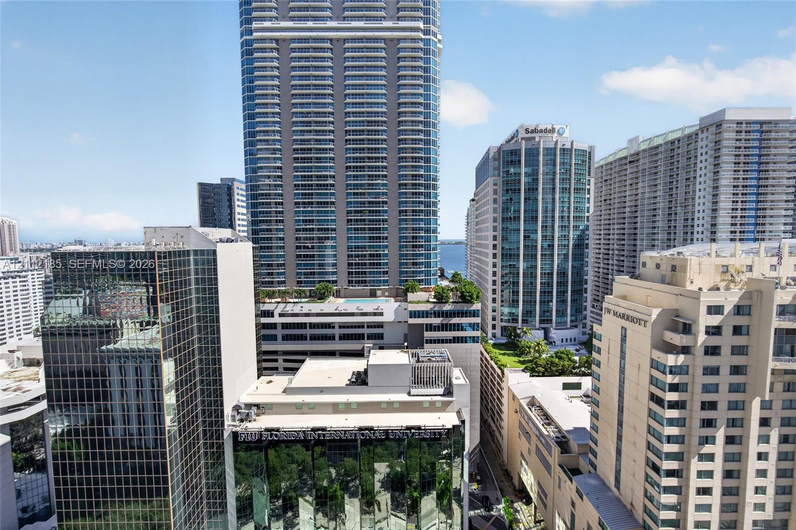High-rise urban landscape featuring glass-clad commercial architecture and densely developed metropolitan surroundings