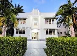 Art Deco exterior featuring a symmetrical facade, tiered roofline, multi-pane casement windows, and prominent central entrance