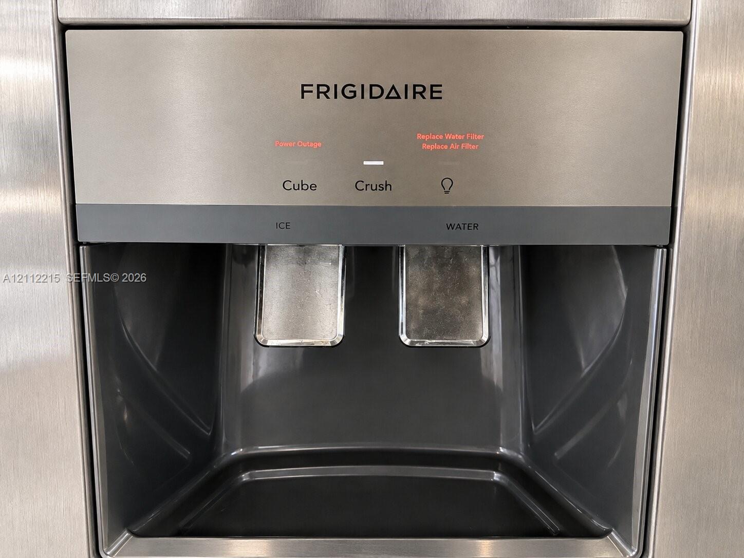 Stainless steel refrigerator featuring a built-in exterior water and ice dispenser with cubed and crushed ice settings