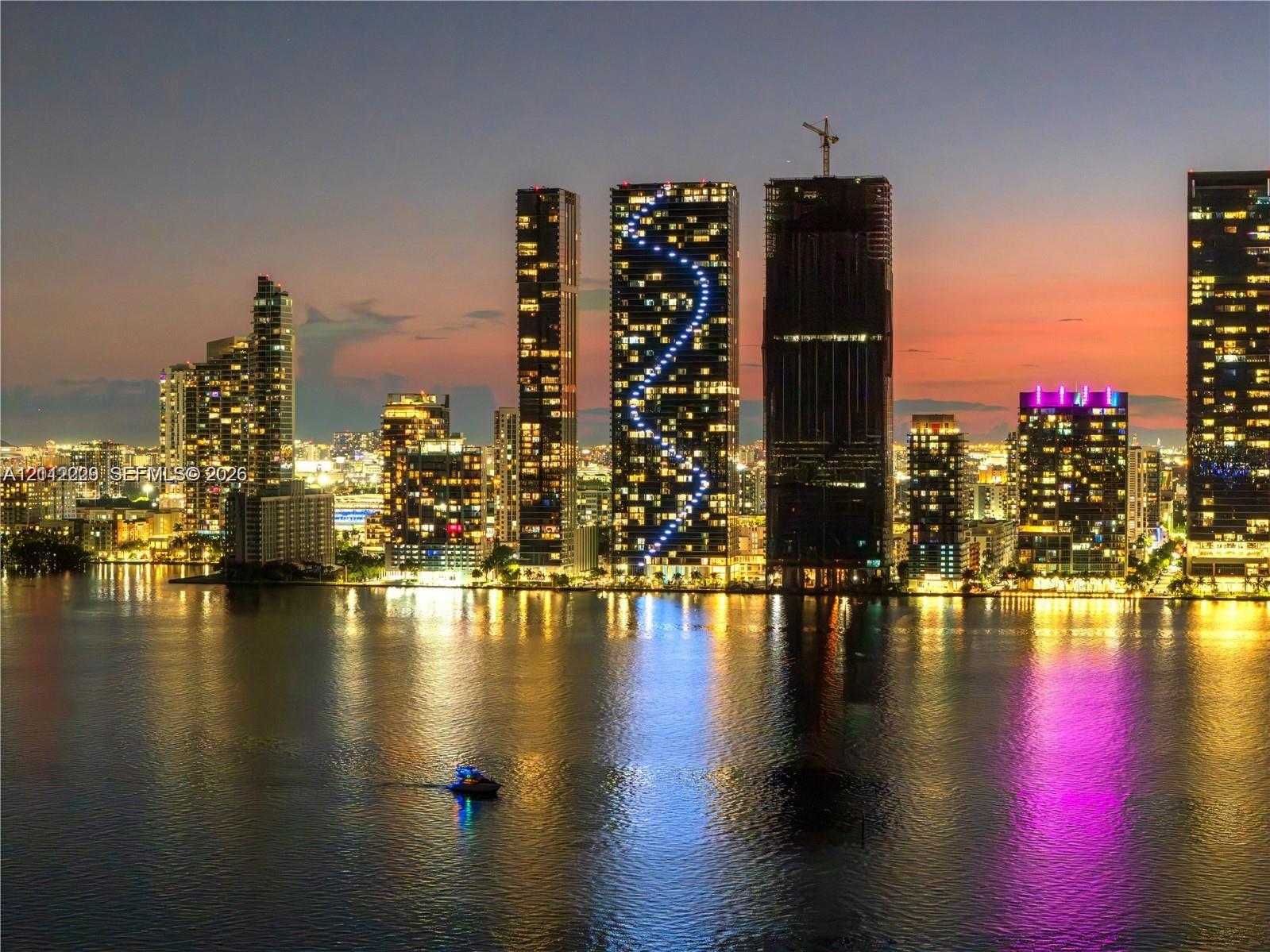 Panoramic city skyline featuring high-rise buildings and expansive water frontage