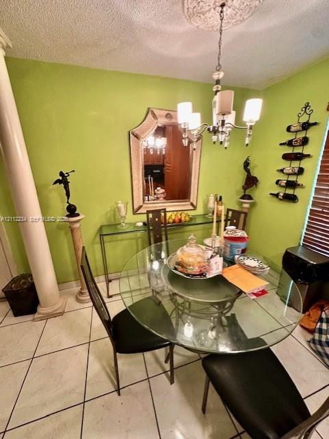 Dining space featuring tile flooring, a prominent architectural column, and a ceiling medallion with a multi-arm light fixture