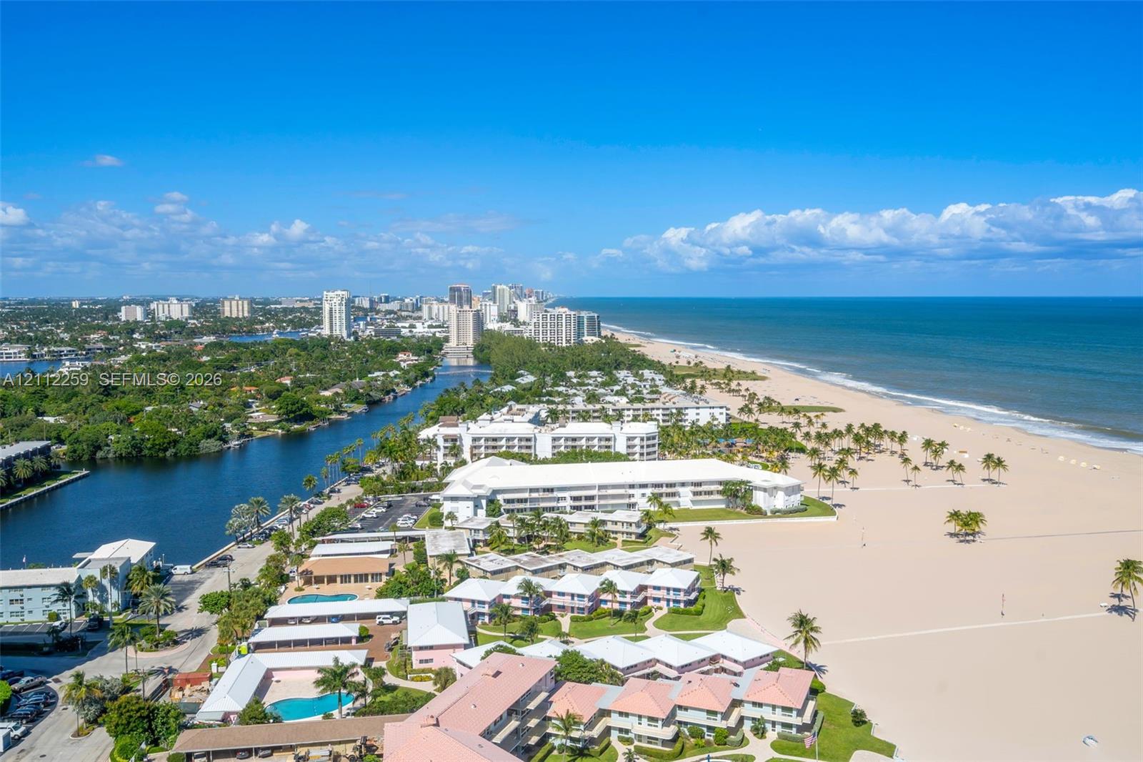 Coastal location featuring expansive sandy beaches, deep-water access, and tropical landscaping