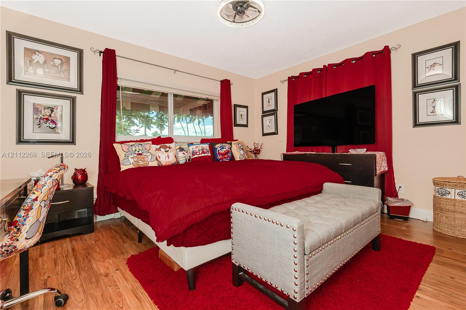Wood-finish flooring, ceiling-mounted light fixture, and horizontal window