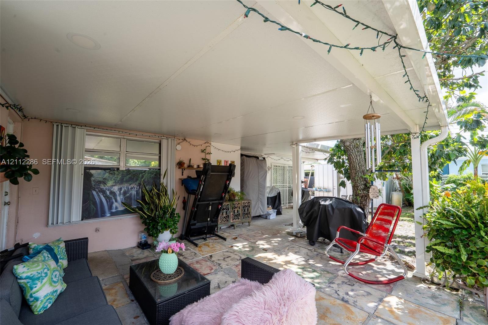 Covered patio featuring a solid-surface ceiling, recessed lighting, and multi-tone stone flooring Covered patio featuring a solid-surface ceiling, recessed lighting, and multi-tone stone flooring