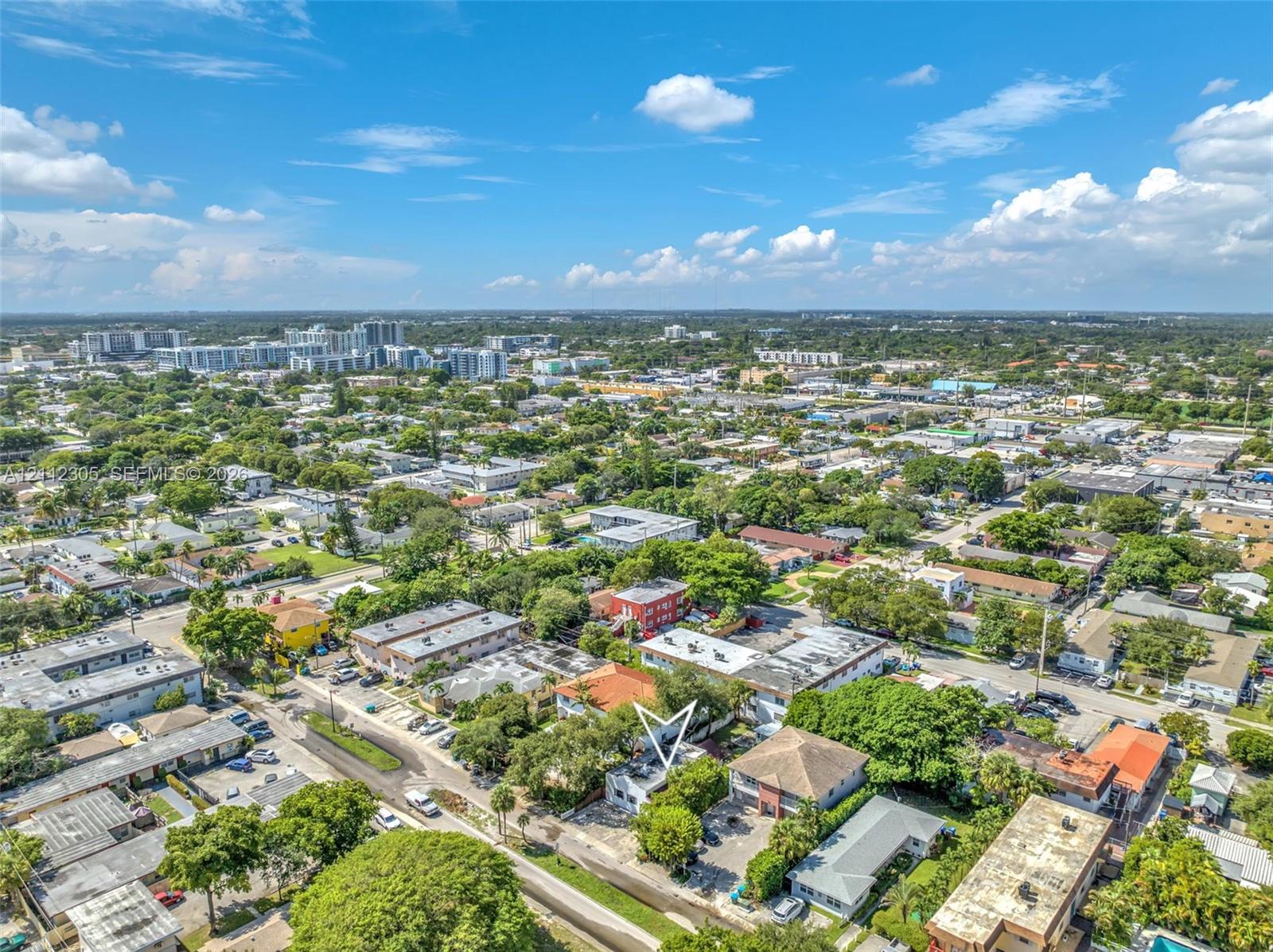 Aerial view of the property and the surrounding neighborhood.