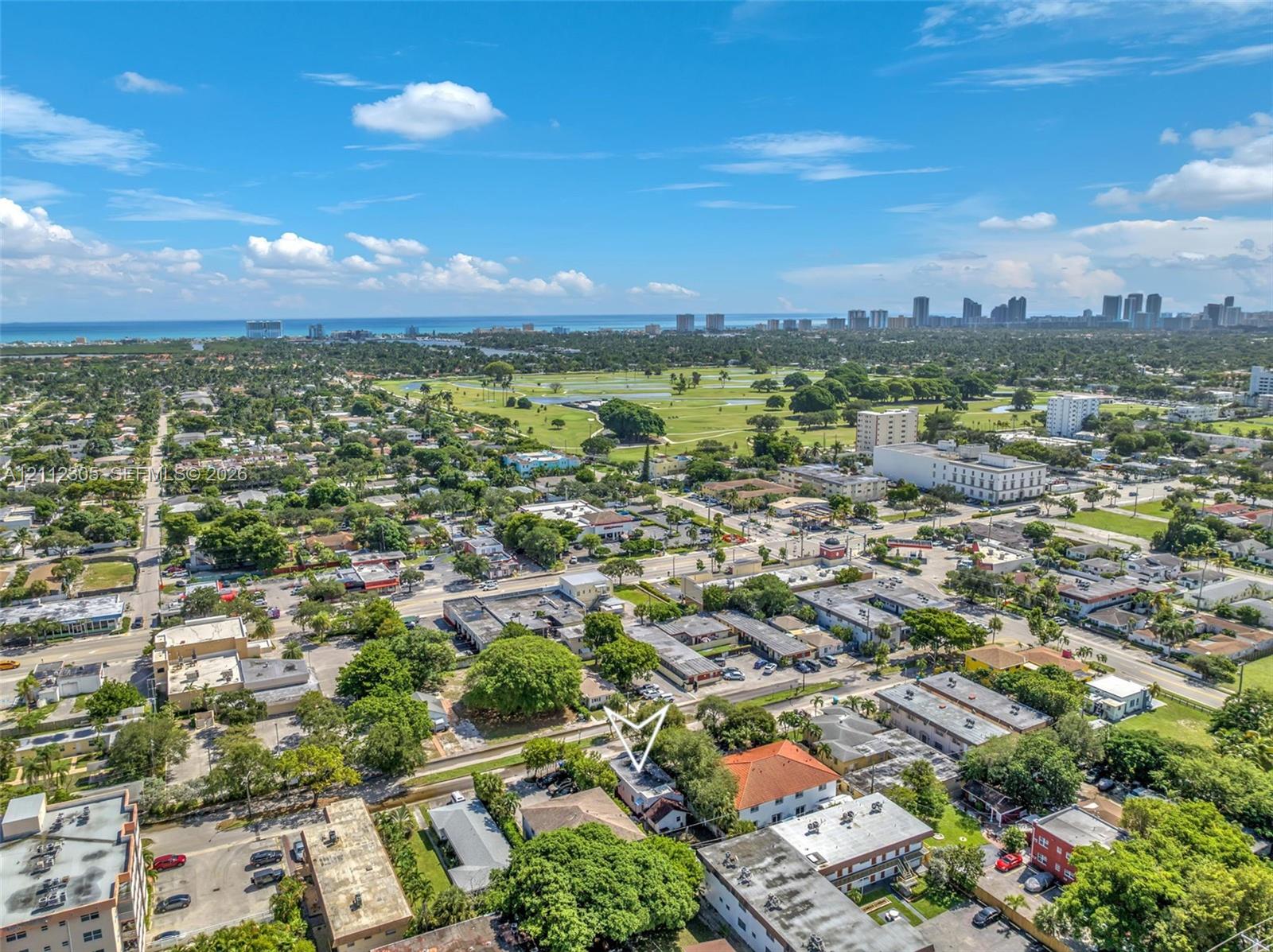 Aerial view of the property and the surrounding neighborhood.