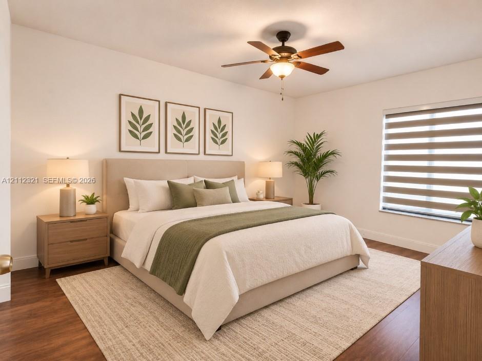 Wood-finish flooring, ceiling fan with integrated lighting, and horizontal window shades