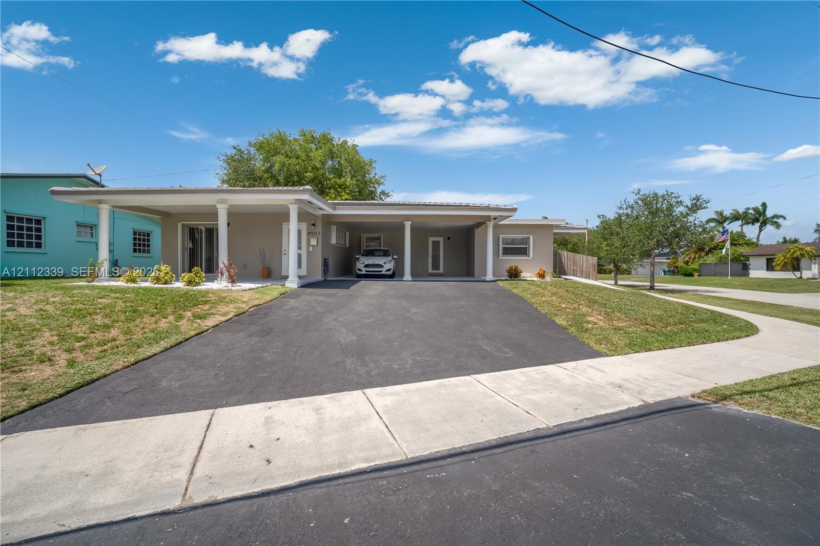 Fully renovated in 2025 * Single-story duplex featuring a private carport for 1 car (on the right side) , and a paved driveway Fully renovated in 2025 * Single-story duplex featuring a private carport for 1 car (on the right side) , and a paved driveway