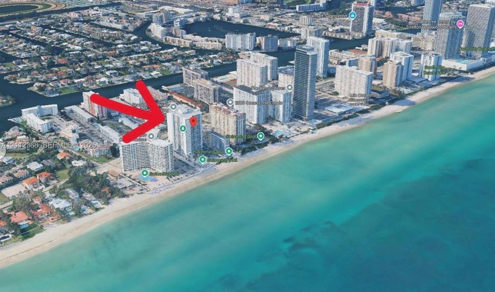 Aerial perspective of coastal high-rise building featuring proximity to the Atlantic Ocean and sandy shoreline
