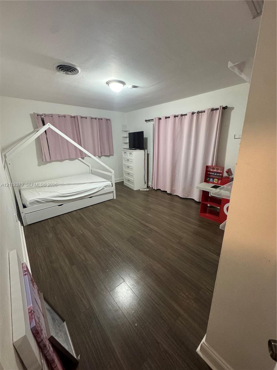 Wood-finish flooring and flush-mount ceiling lighting