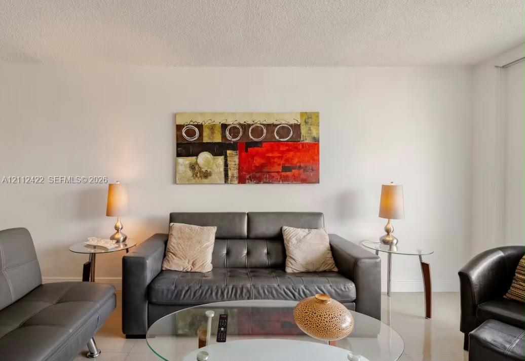 Neutral-toned walls and large-format tile flooring
