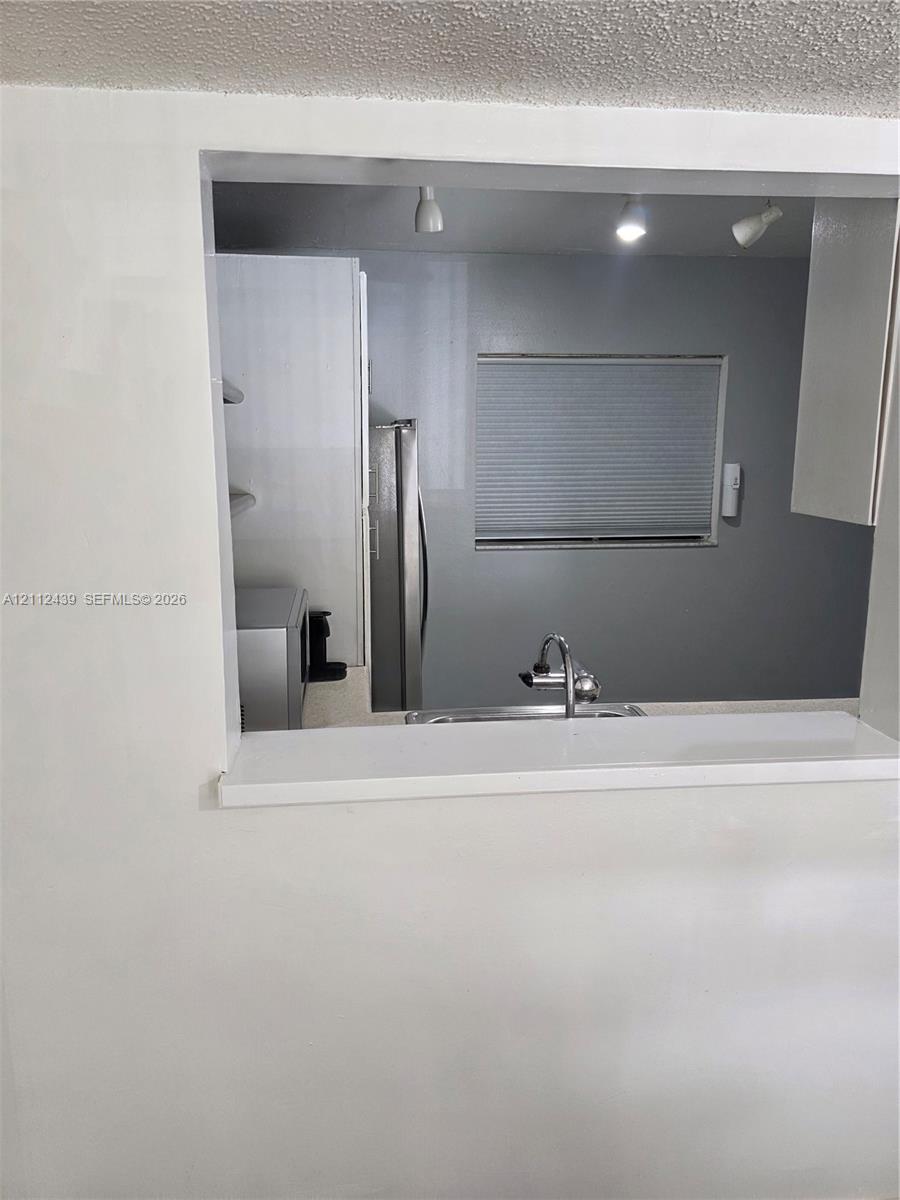 LARGER PASS THRU WINDOW TO DINING AREA