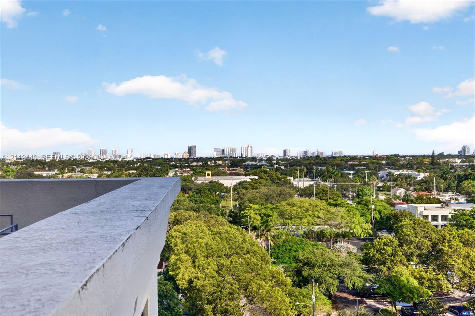 Elevated terrace w/ panoramic skyline backdrop - views toward ocean condos