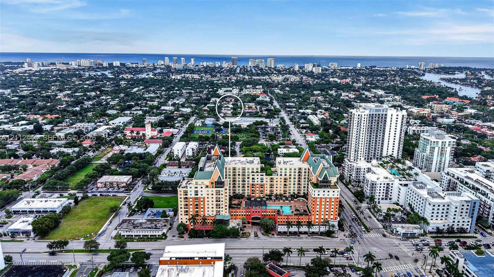 Aerial perspective featuring proximity to the urban skyline and coastal horizon