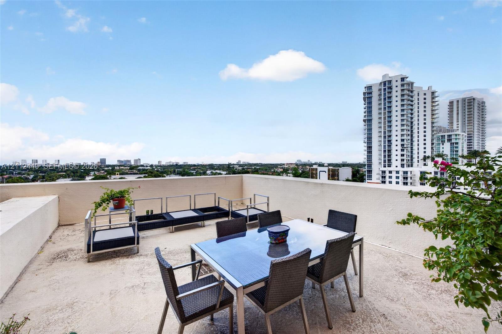 Huge terrace w/ views to the south and east to see downtown and beach condos - over the top of Victoria Park