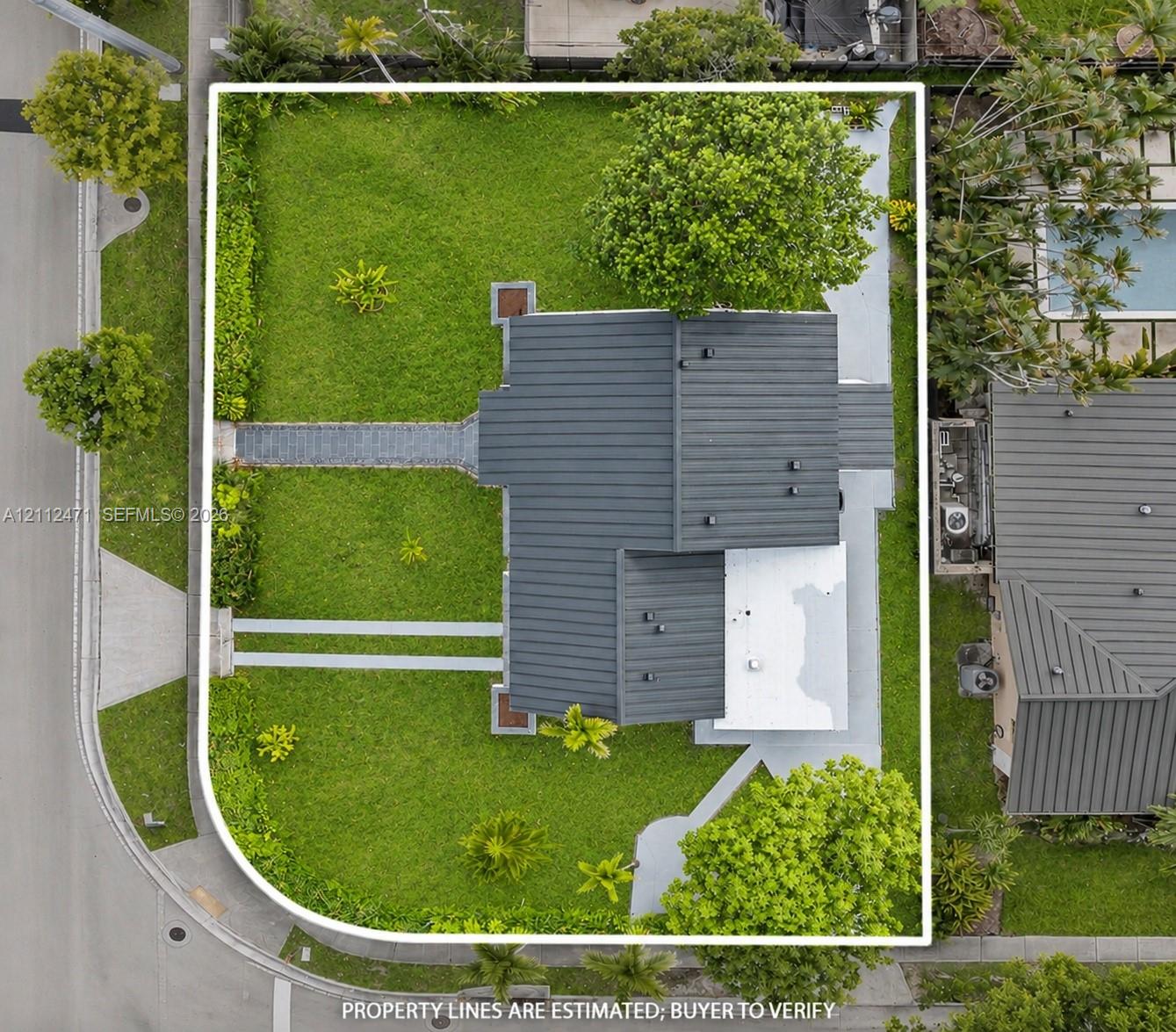 Corner lot featuring extensive lawn space, mature perimeter landscaping, and dual paved walkways Corner lot featuring extensive lawn space, mature perimeter landscaping, and dual paved walkways