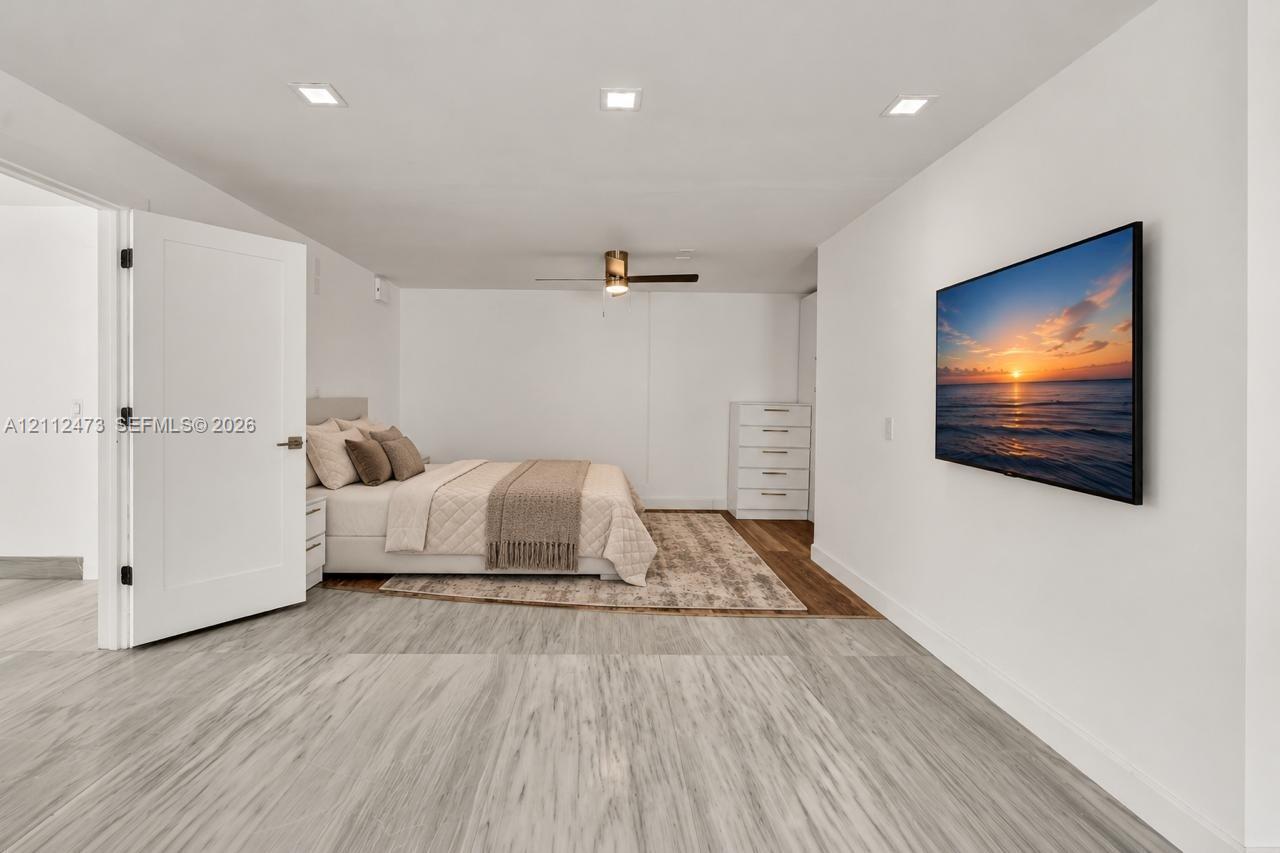 Wood-finish flooring, recessed lighting, and a modern ceiling fan