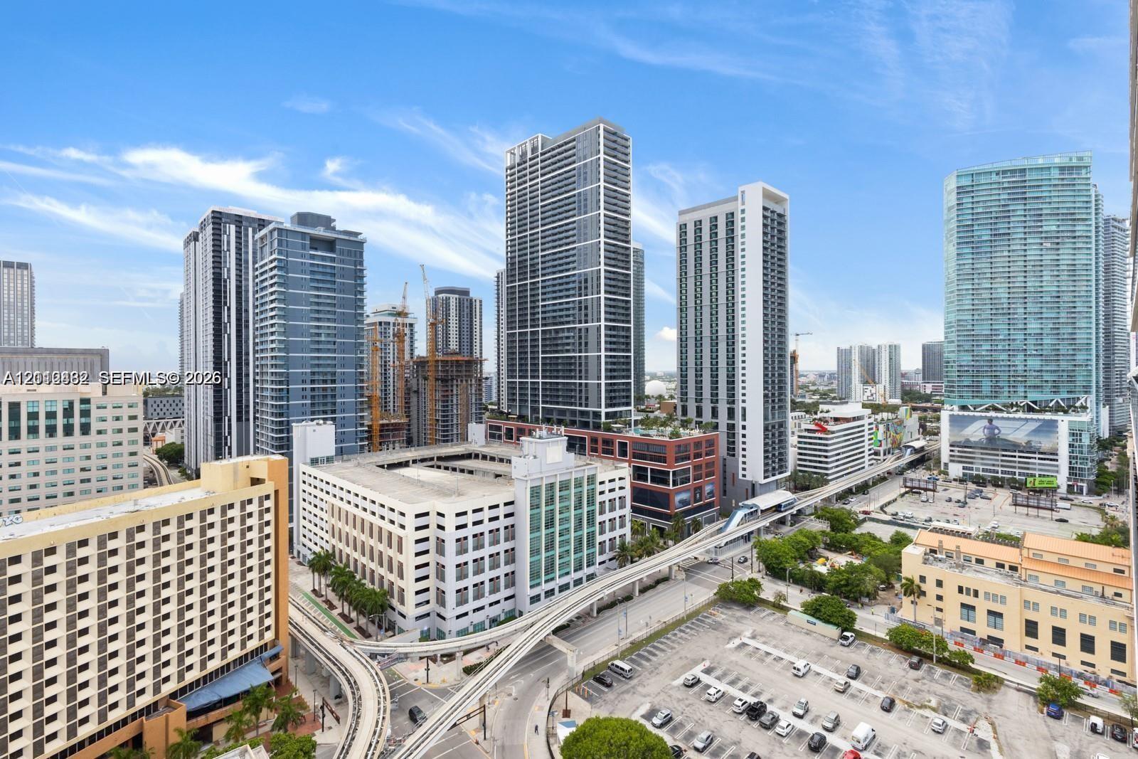 Elevated urban perspective featuring high-rise architecture, glass-facade skyscrapers, and metropolitan infrastructure